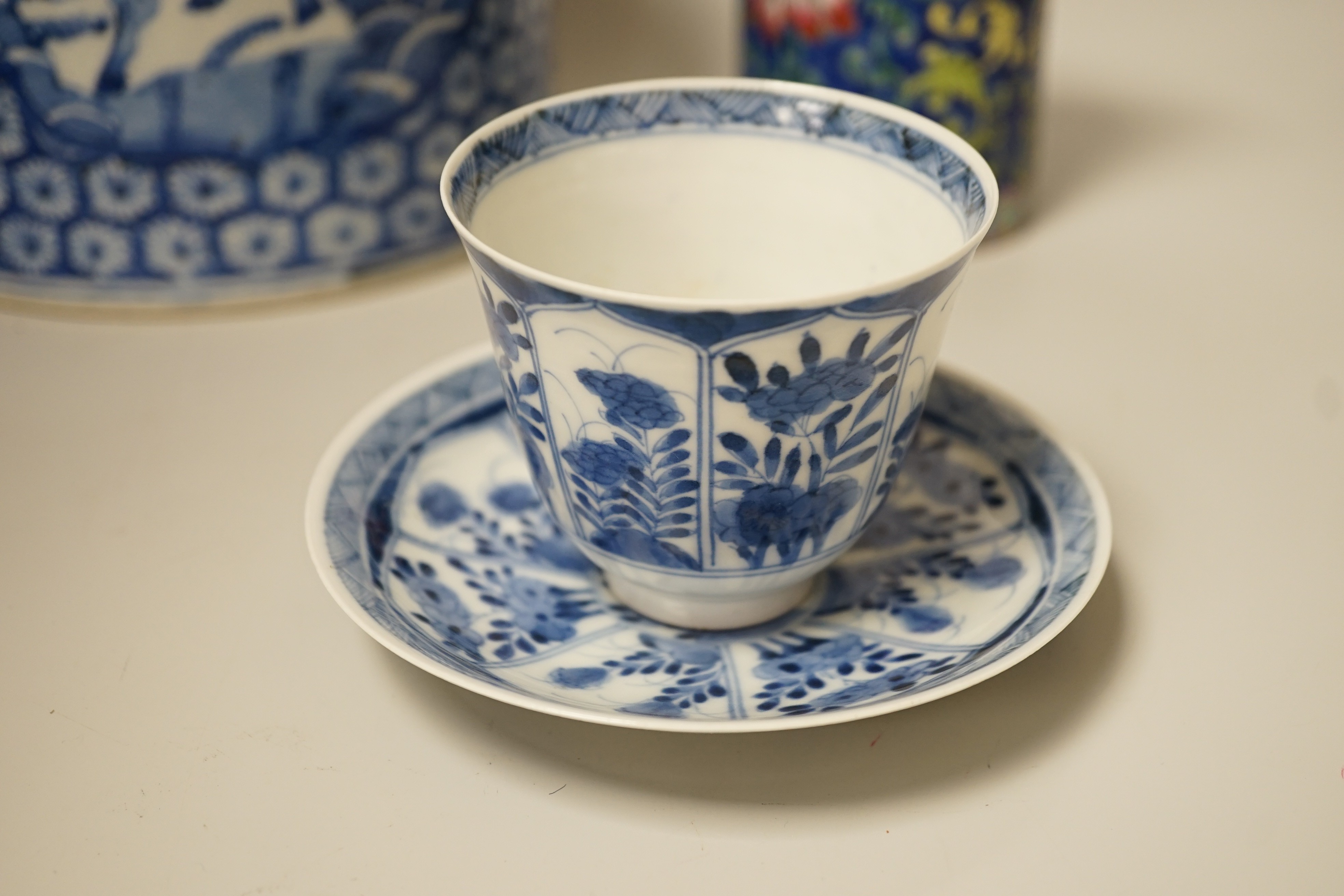 A Chinese blue and white brushpot, enamelled jar, brush pot, famille verte jar cover and a Japanese blue and white tea bowl and cover. Tallest 18cm